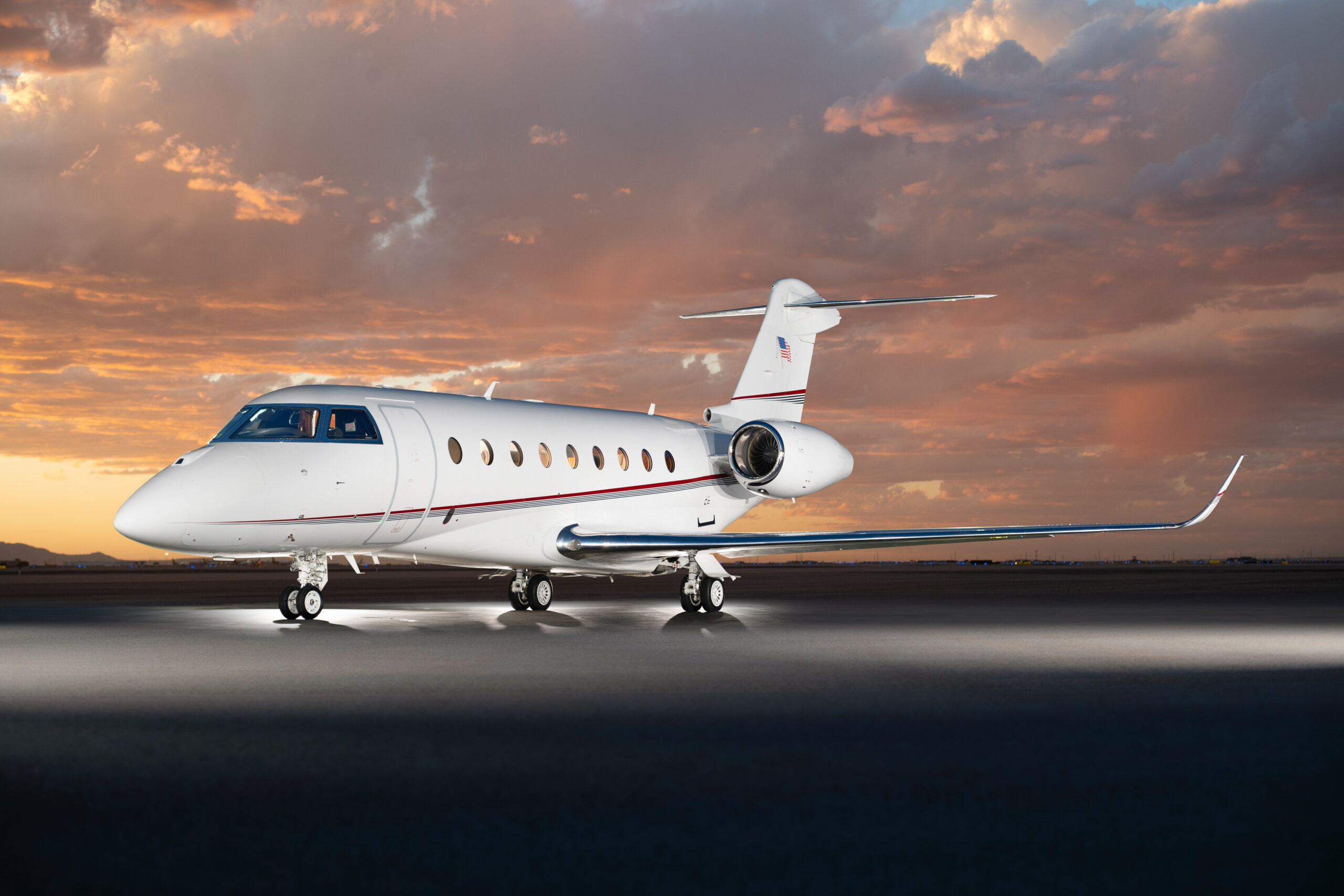 gulfstream g280 private jet on runway during sunset