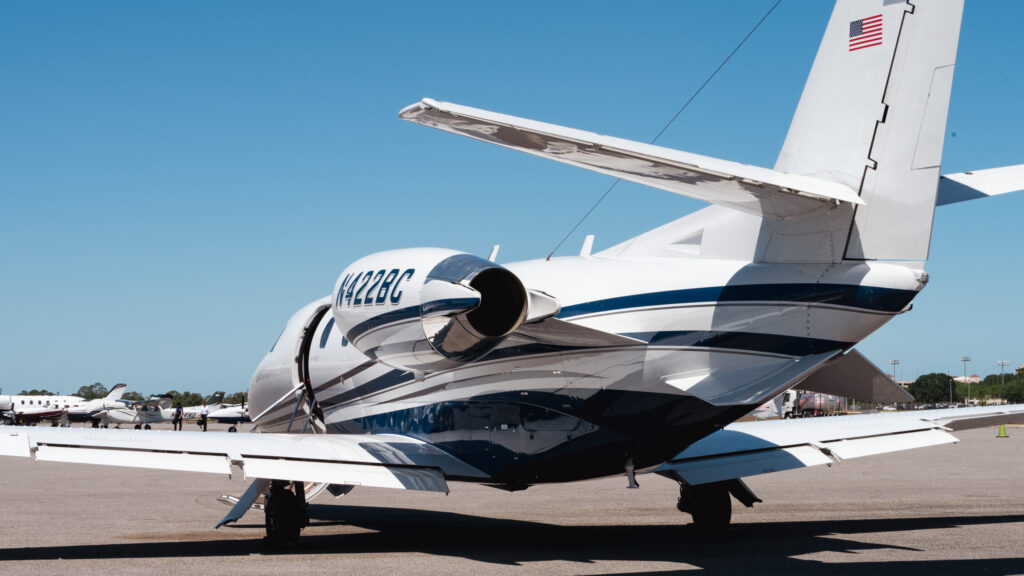 Private jet view from back of plane outside on runway