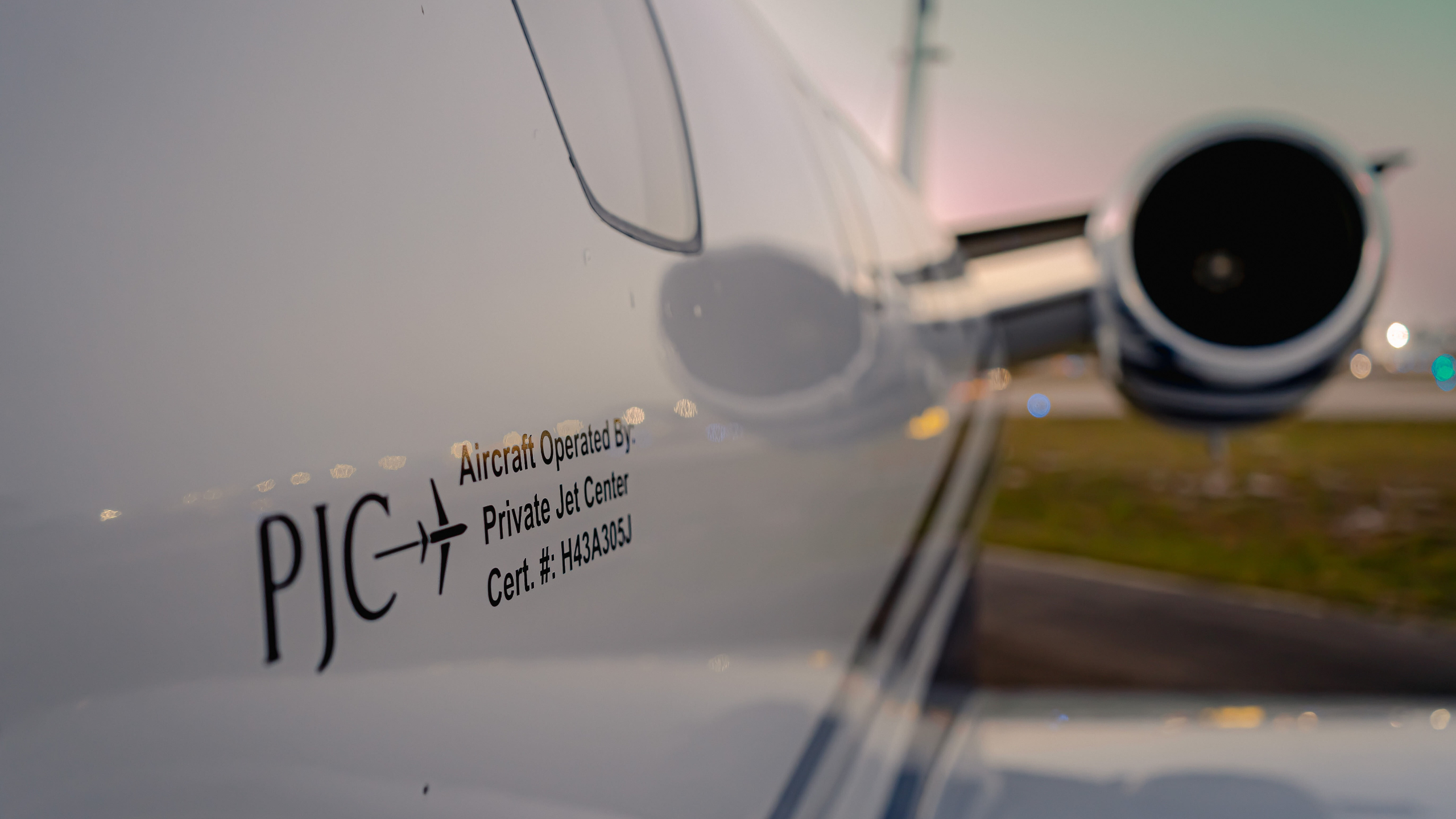 side of private jet with managed by private jet center label