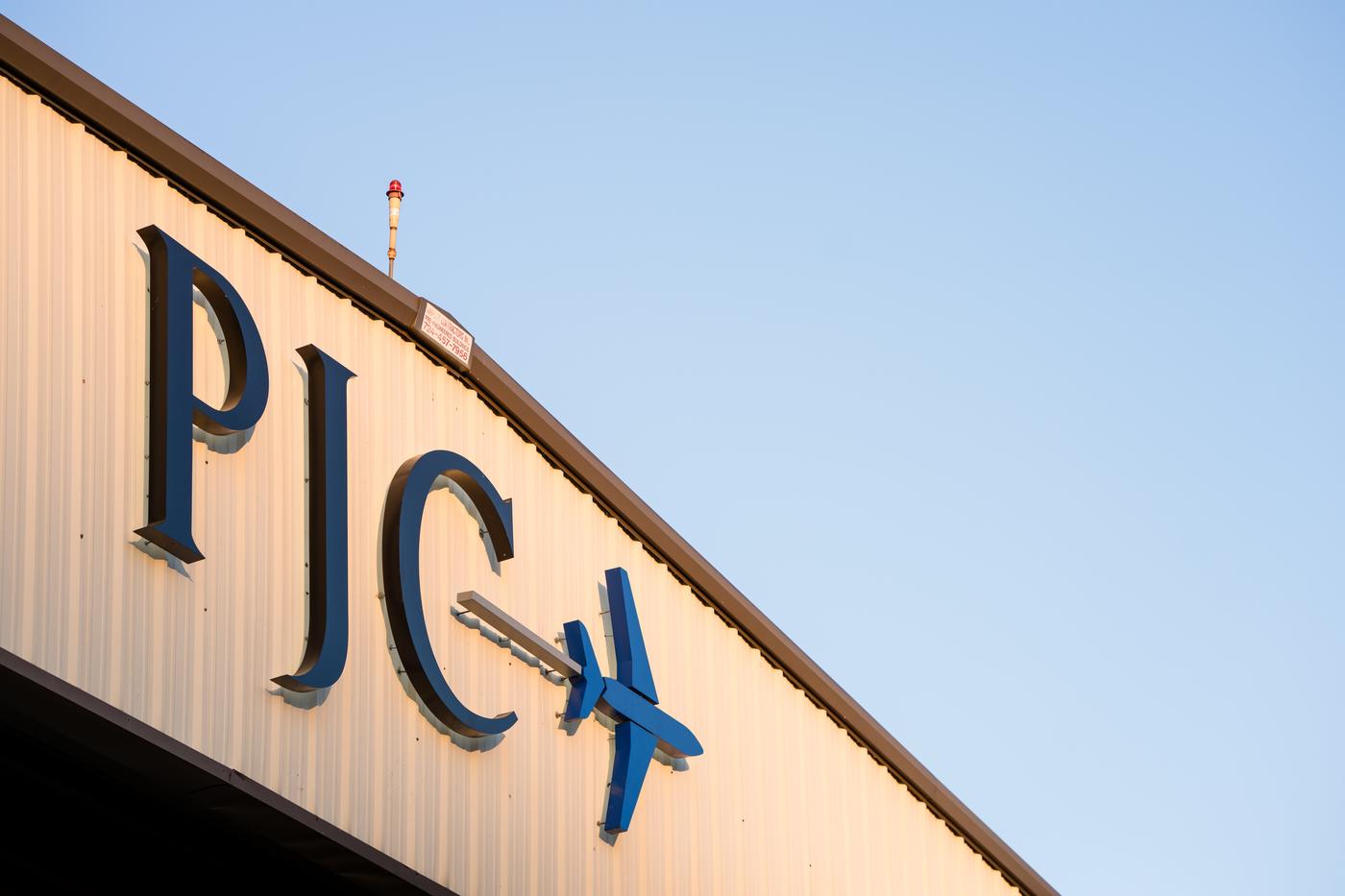 The PJC logo on the Private Jet Center hangar