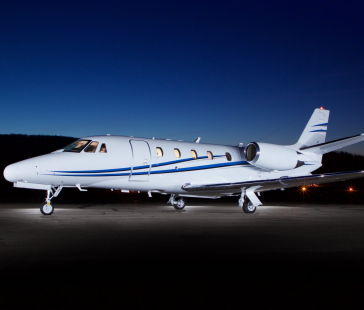cessna citation XLS Mid-size private jet on runway at night